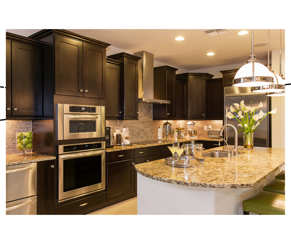 Custom kitchen with dark wood shaker cabinets, granite countertops, stainless appliances, and pendant lighting over the island