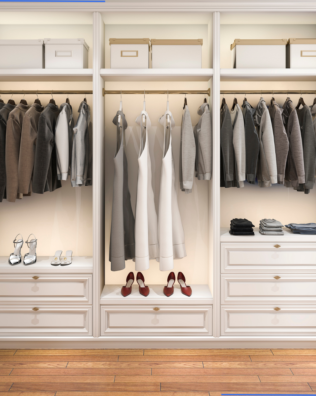 Floor-to-ceiling white built-in wardrobe with hanging space, drawers, shoe shelves, and warm accent lighting